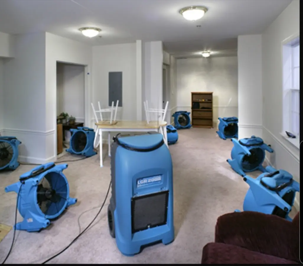 Air movers and dehumidifier setup for Water Damage Restoration in New Holland
