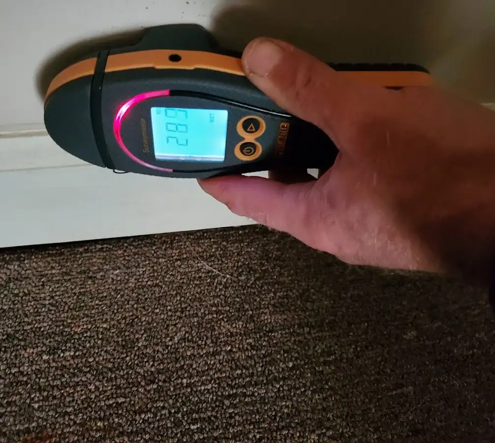 Moisture detection at baseboard during Storm Damage Restoration in New Holland